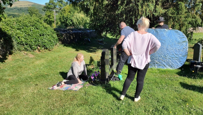 Actor rehearses lines in cemetry